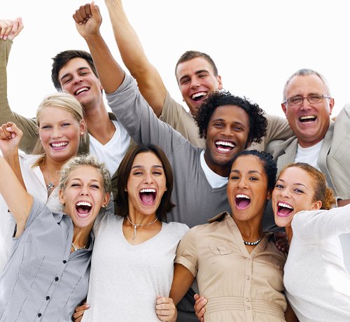 Portrait of a group of business people laughing against white ba